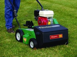 Petrol-powered Billy Goat lawn scarifier and overseeder for rent from Alayan Rentals operating on a green lawn