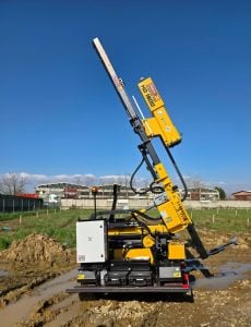 Alayan Rentals HD 1500 professional crawler post driver on rental, positioned at an outdoor job site