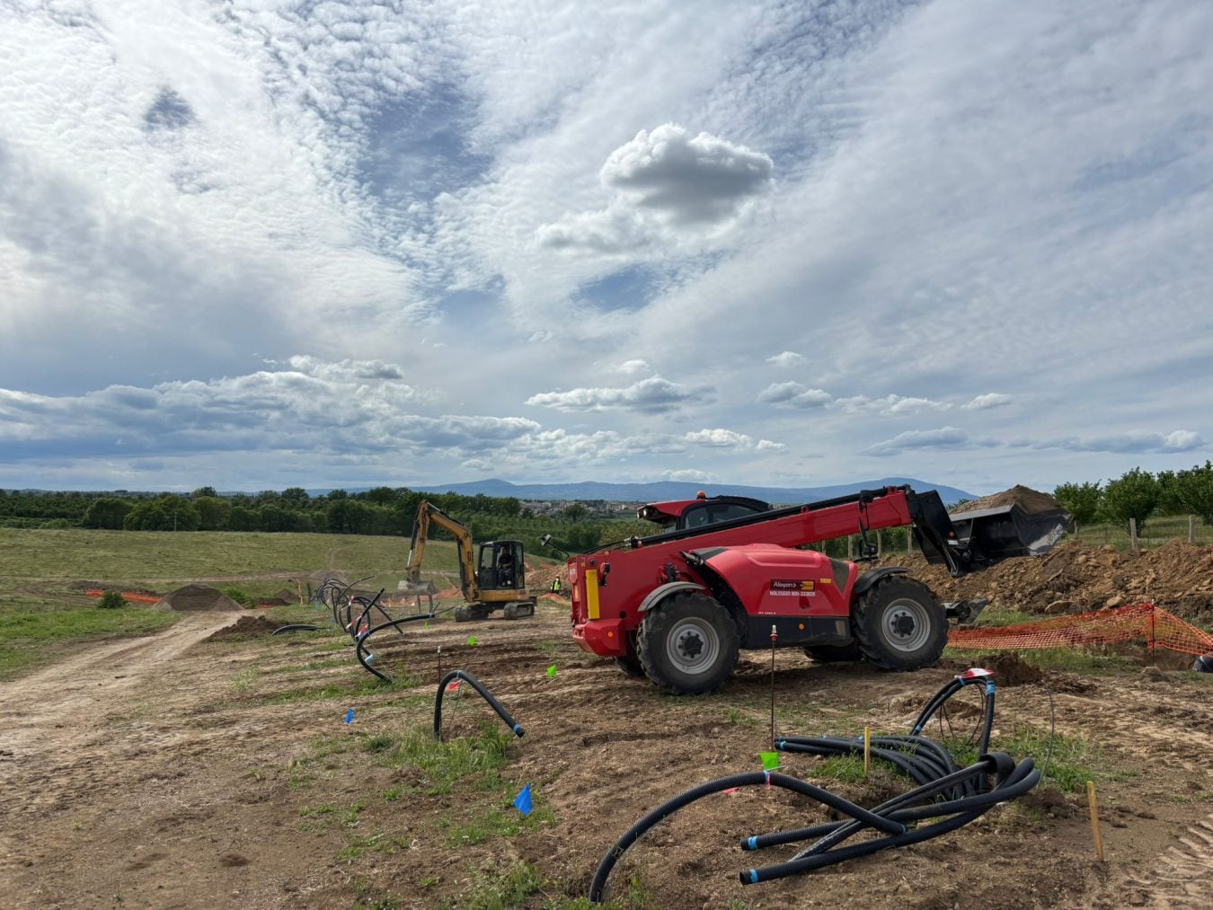Manitou telehandler on rental at an energy infrastructure construction site Alayan Rental
