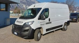 White Opel Movano commercial van for rent from Alayan Rentals parked in the company main outdoor yard