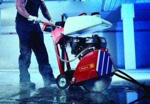 Operator working with a rented Norton Clipper CS451 asphalt and concrete cutter from Alayan Rentals
